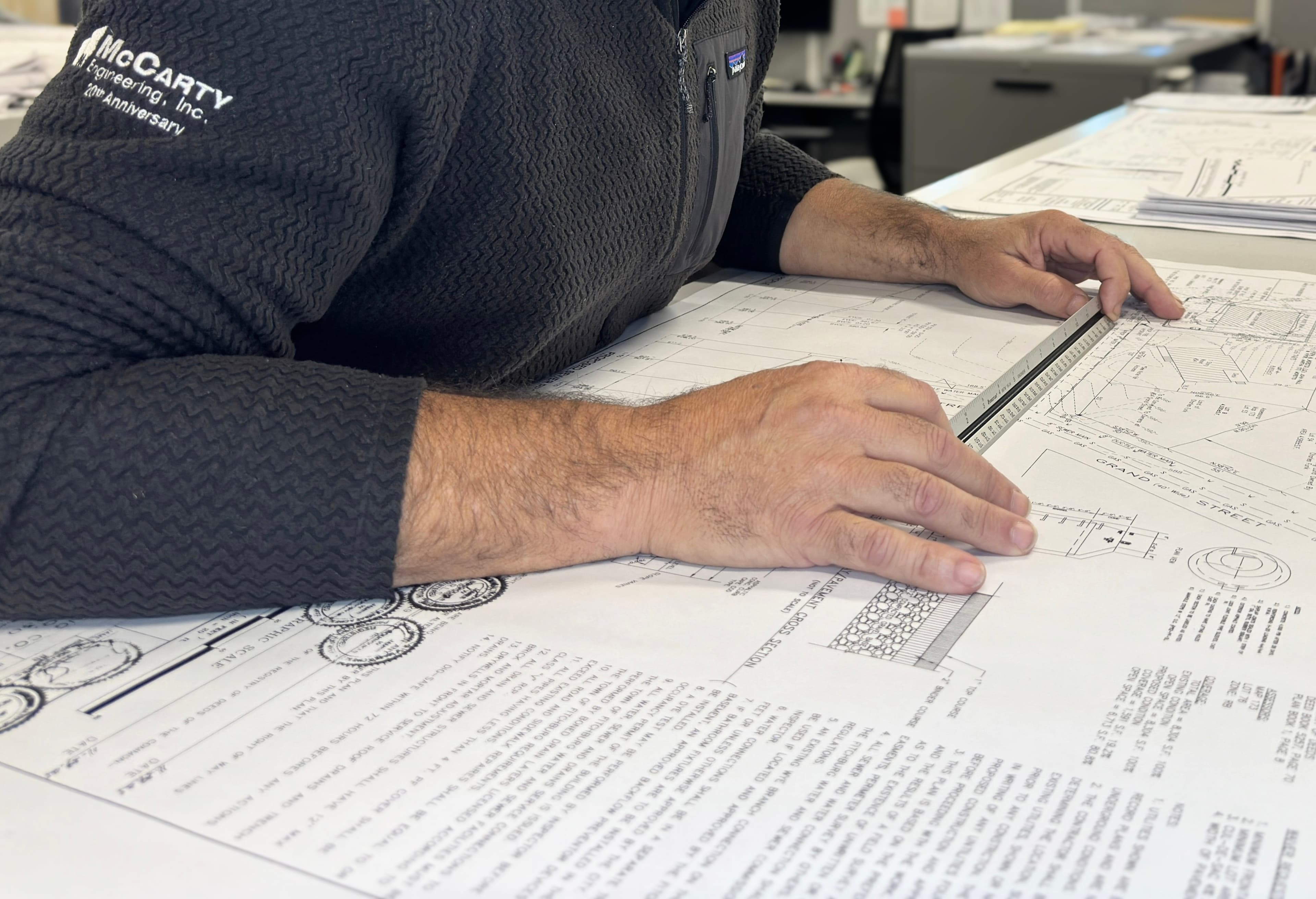 Civil engineer reviewing site development plans at McCarty Engineering Massachusetts